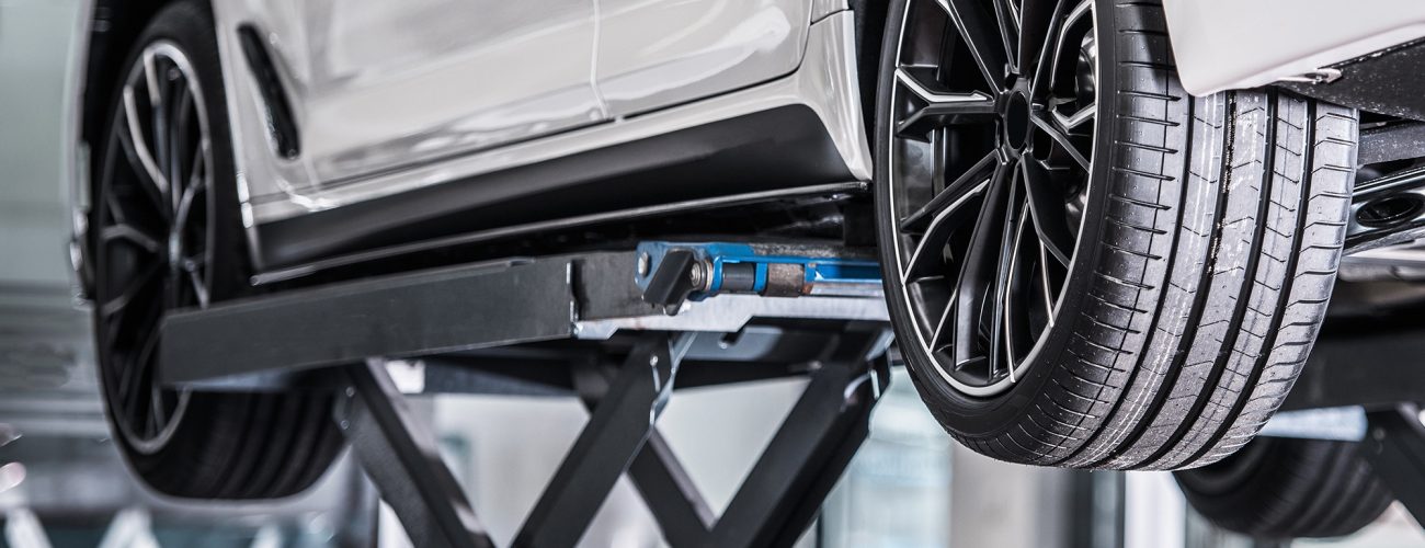 Car Repair on a Lift Car Repair on a Lift. Vehicle Maintenance. Automotive Technologies.